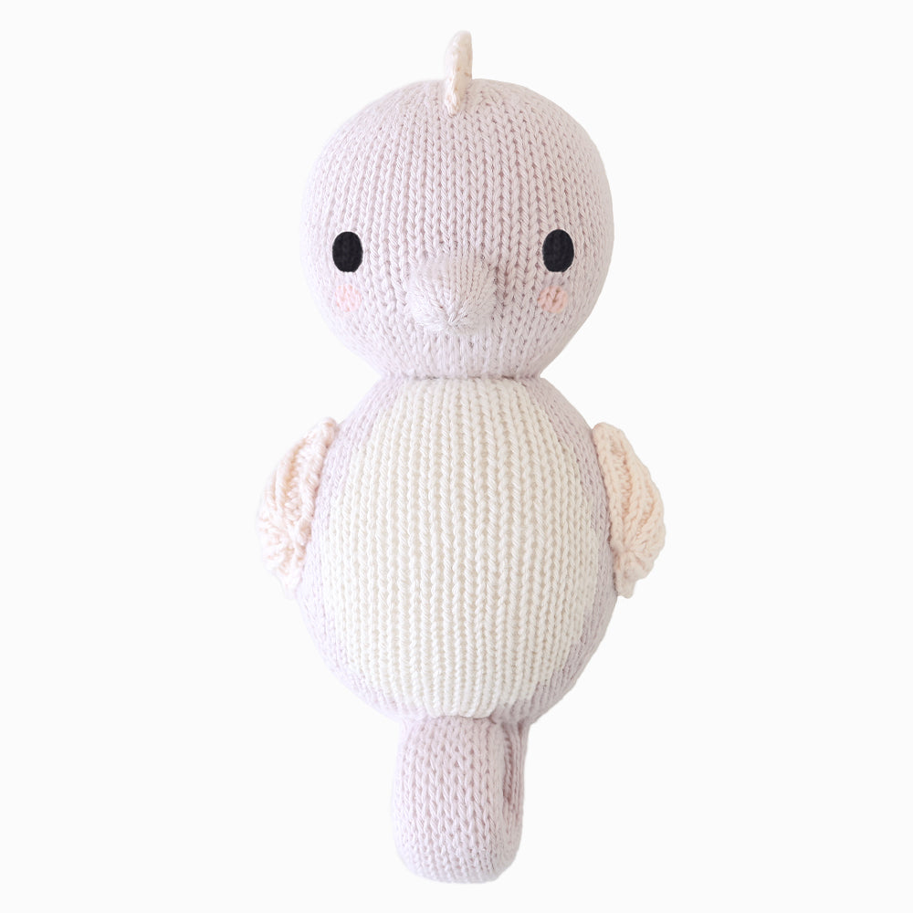 
                  
                    Cuddle + Kind Baby Seahorse (Lilac), a hand-knit lilac and cream seahorse plush with embroidered details, displayed on a white background.
                  
                
