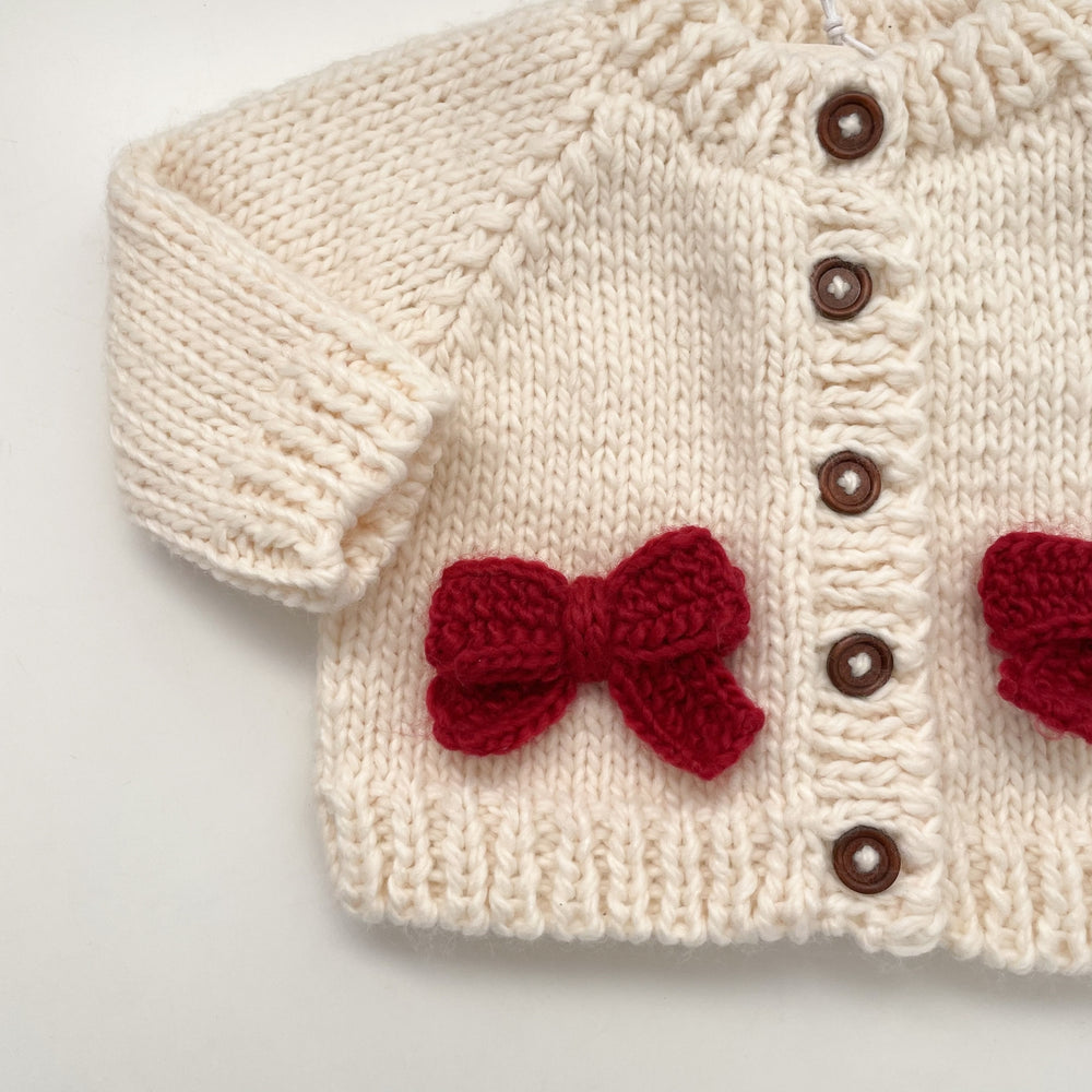 
                  
                    Bow Cardigan, Cream/Red
                  
                