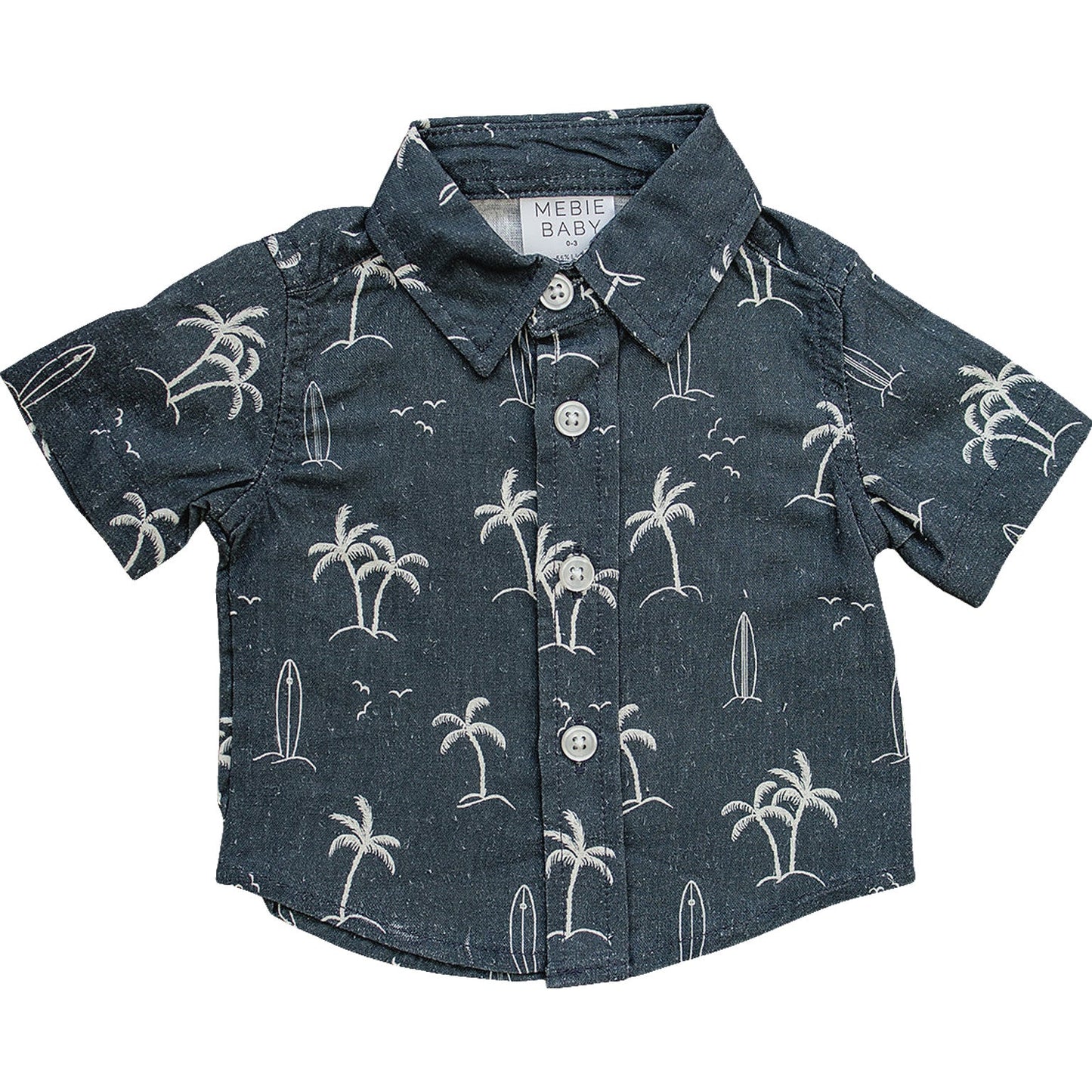 Flat lay of the Mebie Baby Navy Surfer Linen Button Up Shirt, a short-sleeve navy shirt with white palm tree and surfboard design, displayed on white background.