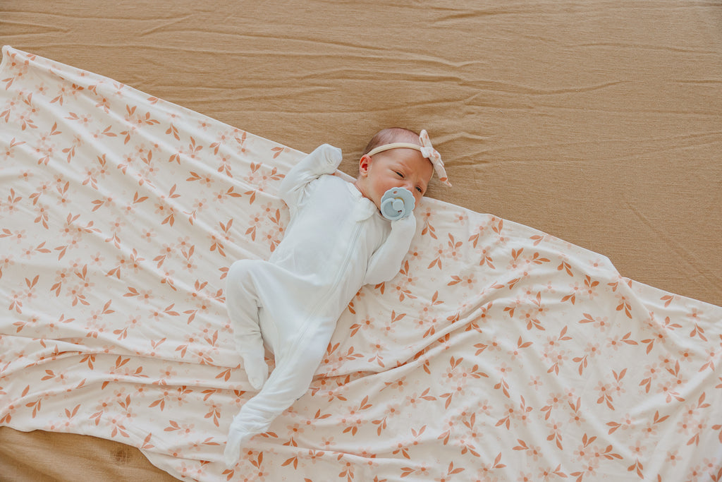 
                  
                    Rue Knit Swaddle Blanket
                  
                