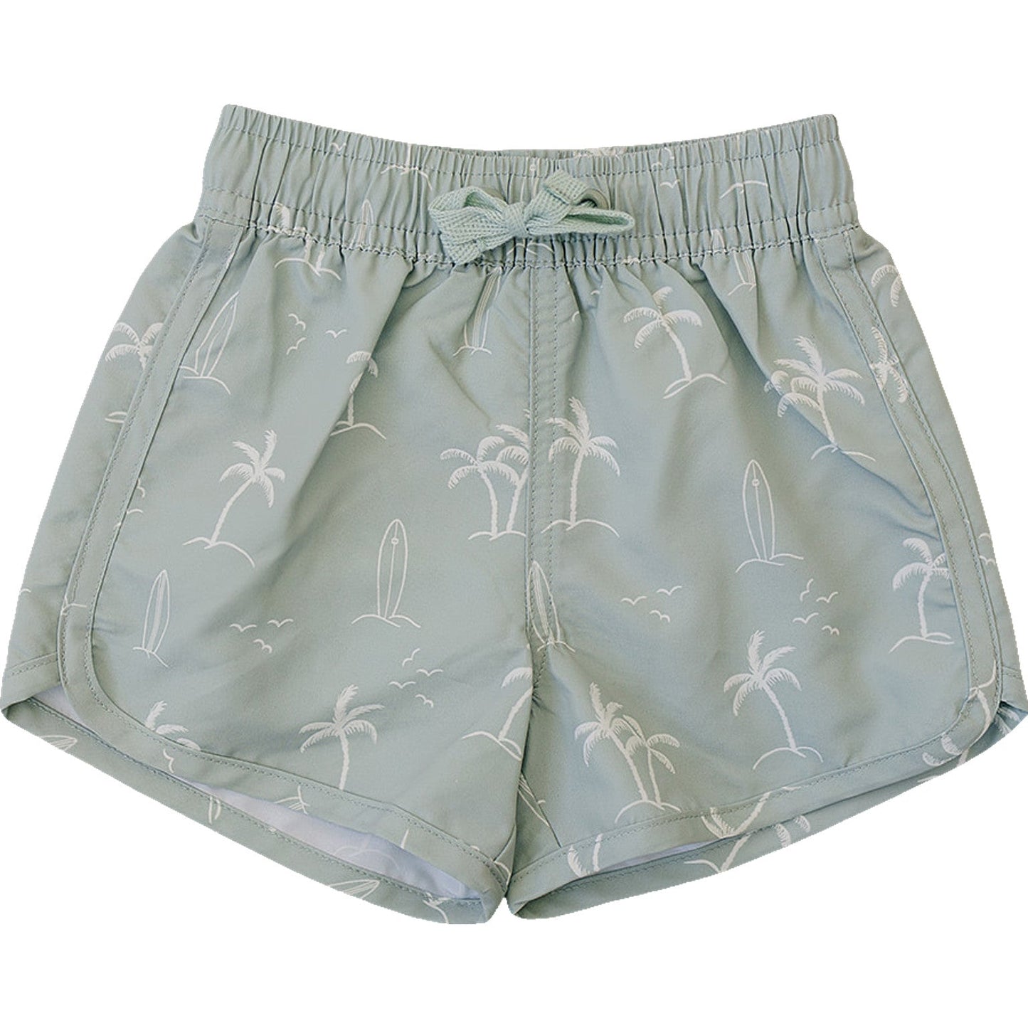 Flat lay of Mebie Baby Sage Surfer Swim Shorts, light green swim shorts featuring white palm tree, surfboard, and seagull pattern, displayed on a white background.