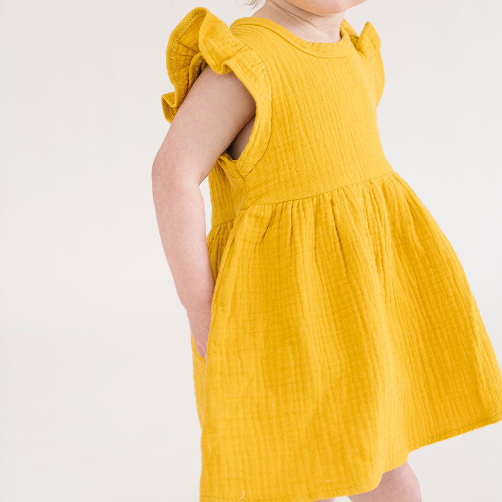 
                  
                    The Emma Dress in Bronze
                  
                