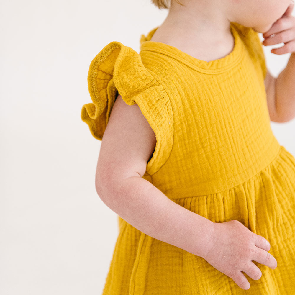 
                  
                    The Emma Dress in Bronze
                  
                