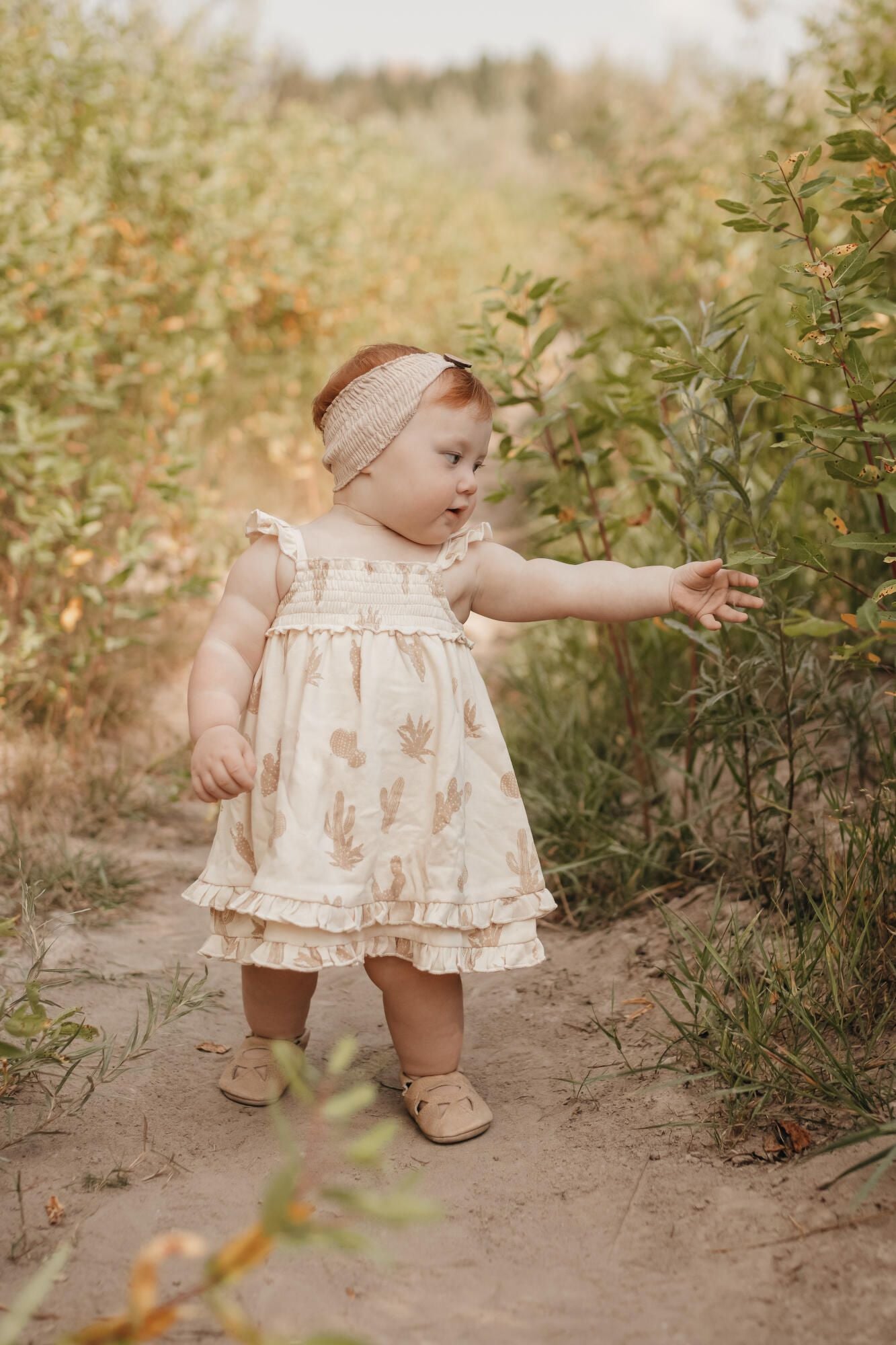 
                  
                    Printed Smocked Summer Dress in Buttercream Cactus
                  
                