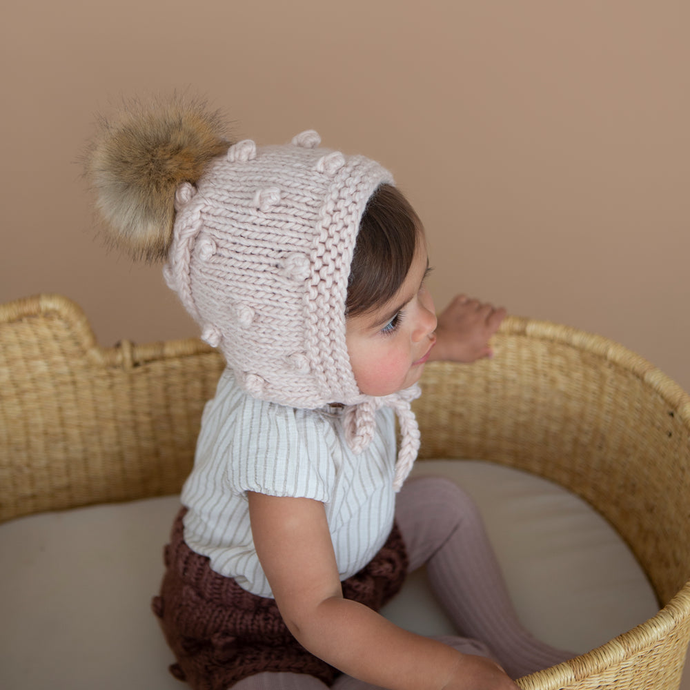 
                  
                    Dusty Rose Coco Bonnet with Pom
                  
                
