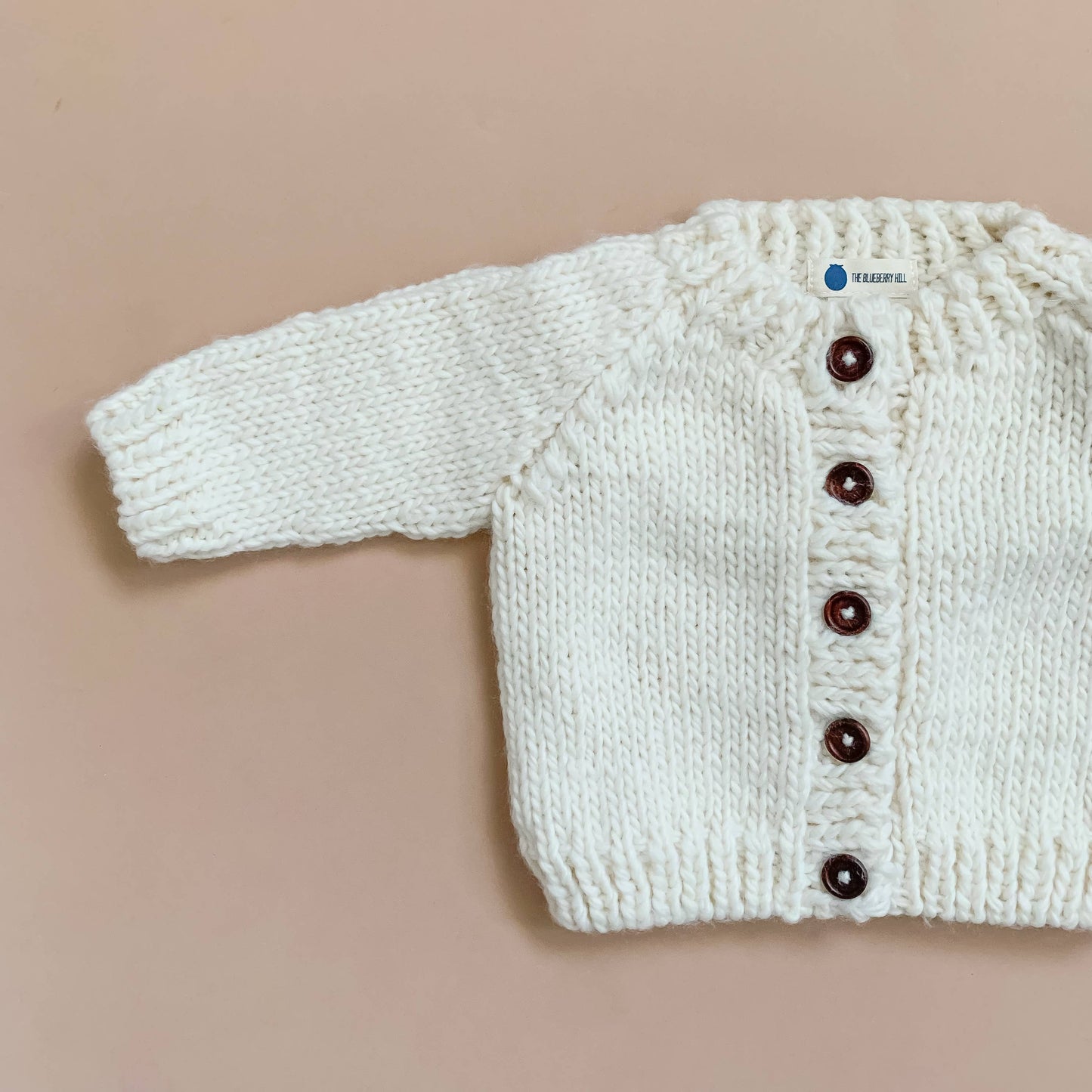 
                  
                    Cream Classic Cardigan
                  
                