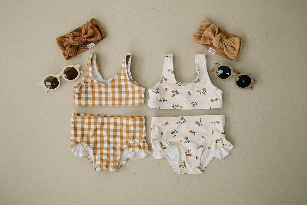 
                  
                    Cream Floral Bikini Set with Ruffle Bottom
                  
                