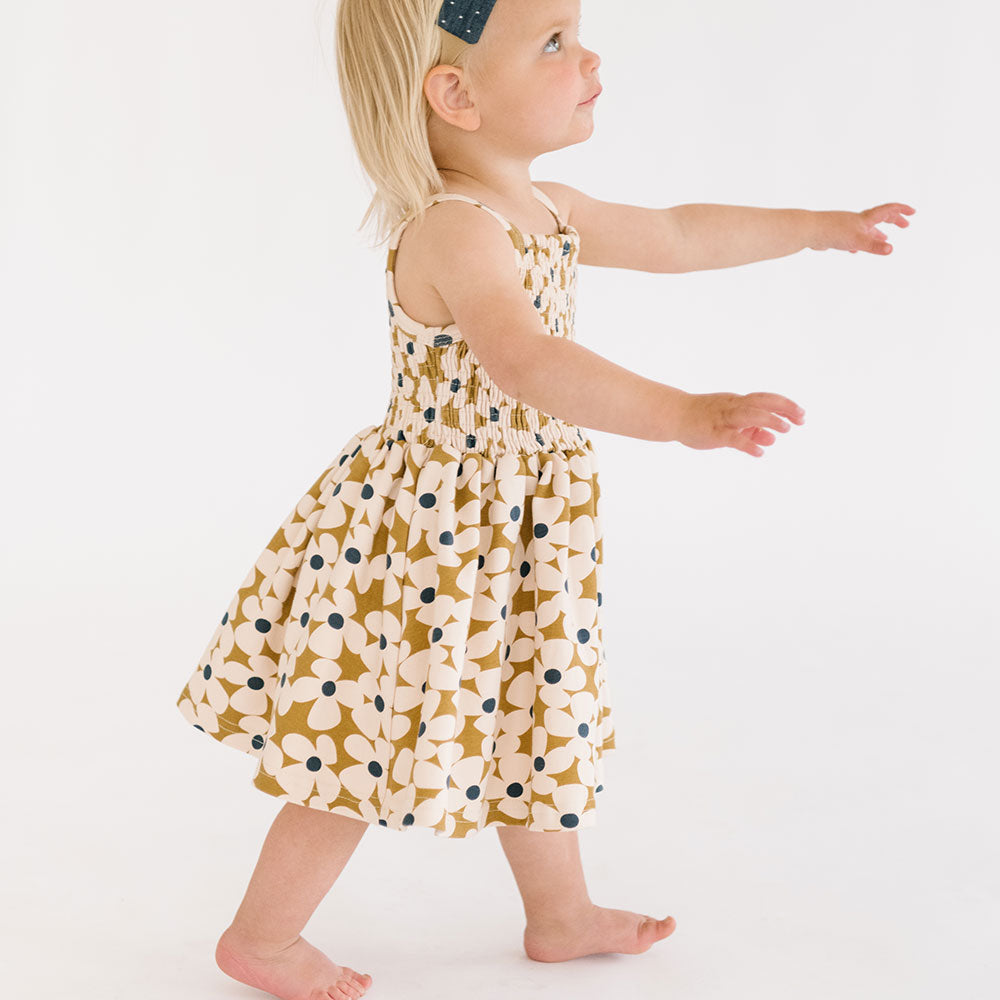 
                  
                    The Baby Smocked Dress in Crowded Petal
                  
                