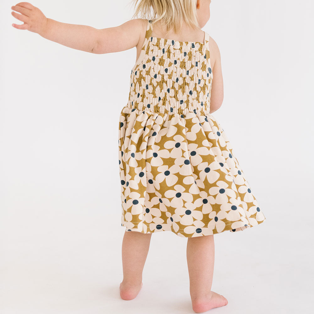 
                  
                    The Baby Smocked Dress in Crowded Petal
                  
                