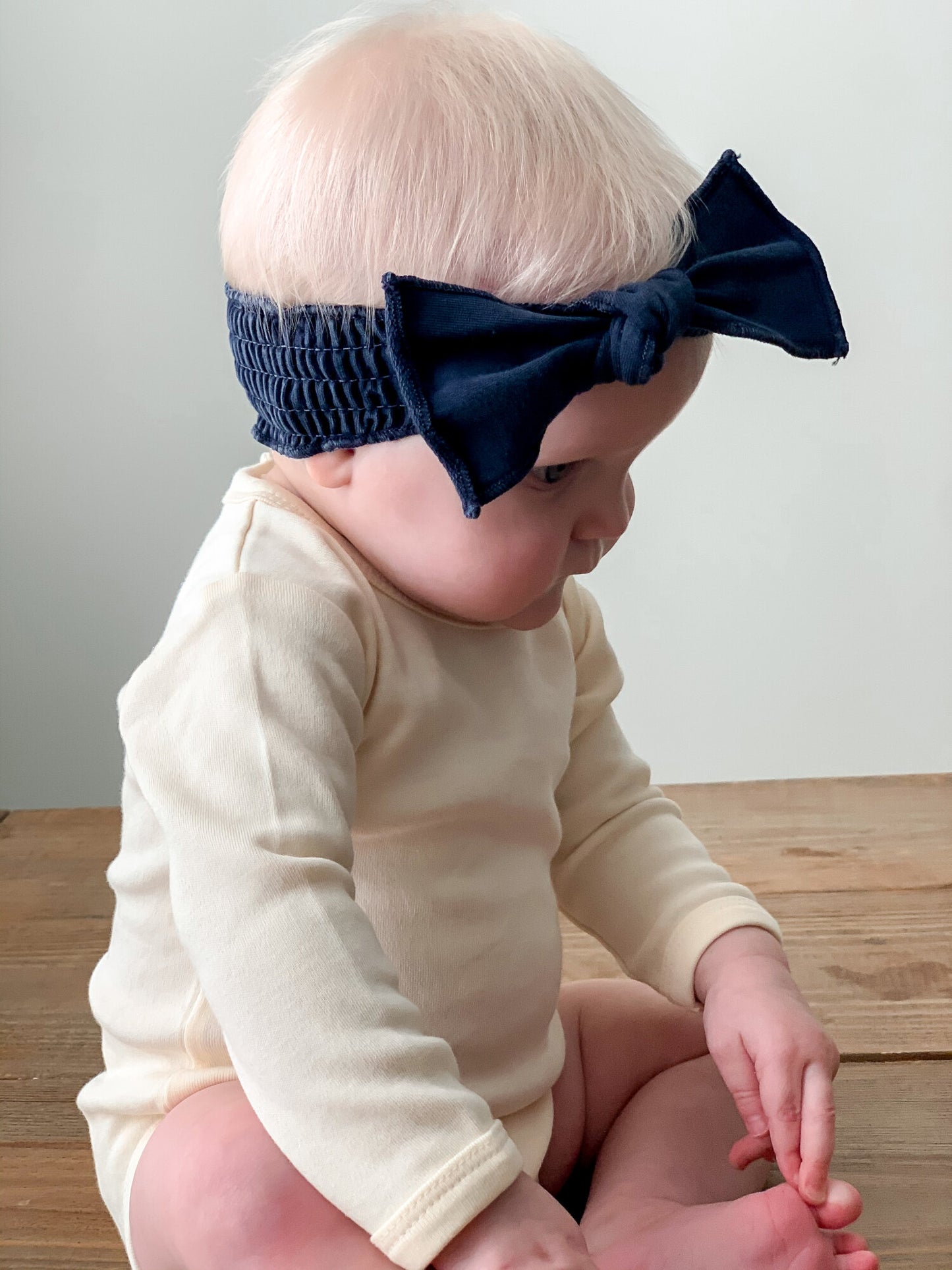 
                  
                    Faux Denim Smocked Headband in Navy
                  
                