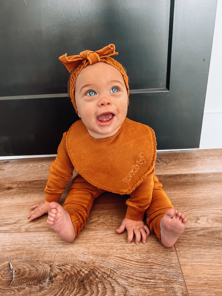 
                  
                    French Terry Reversible Bib in Butterscotch
                  
                