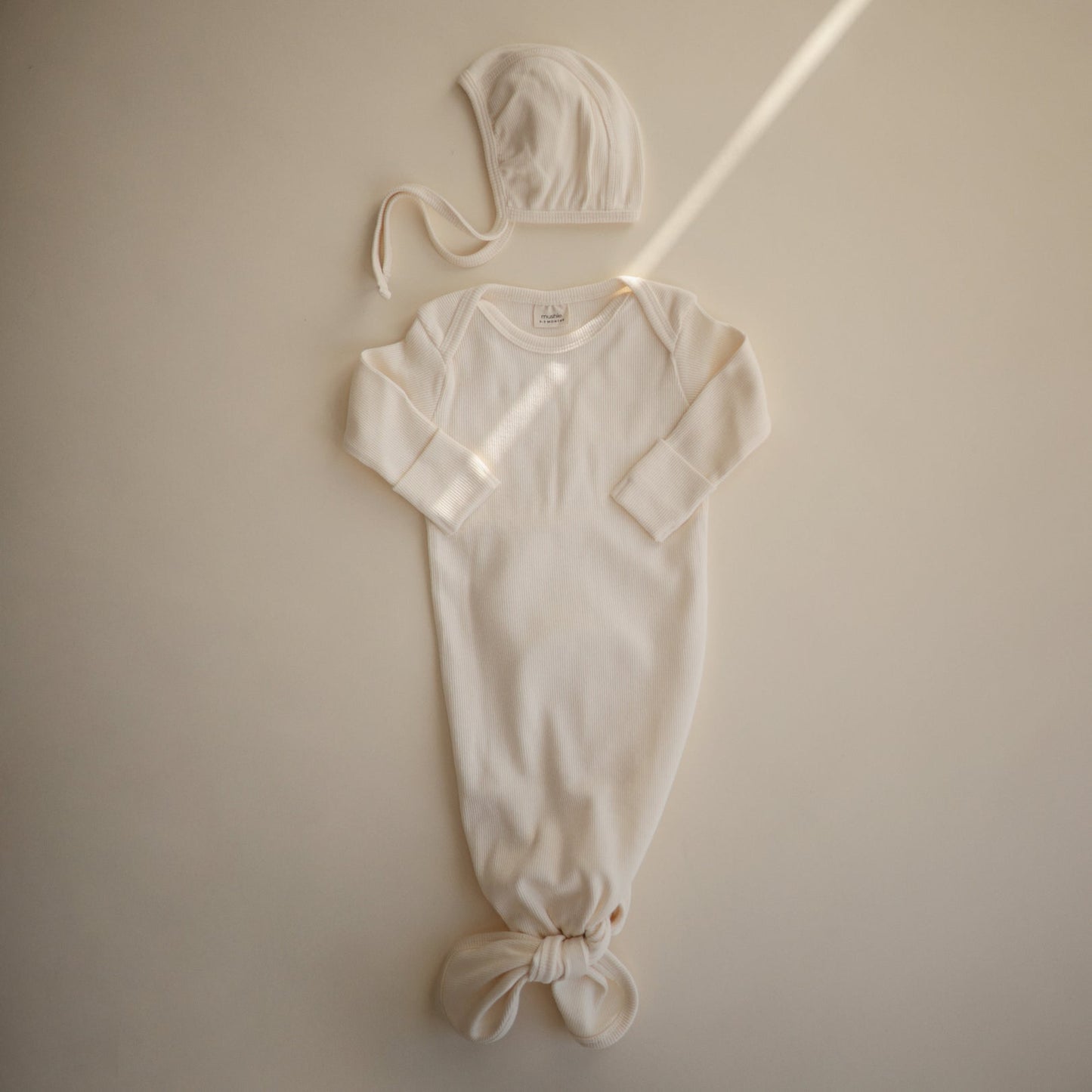 
                  
                    Ribbed Baby Bonnet (Ivory)
                  
                