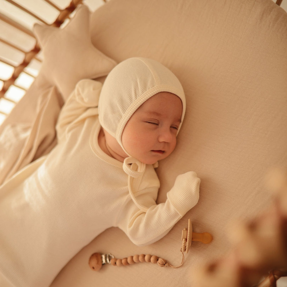 
                  
                    Ribbed Baby Bonnet (Ivory)
                  
                