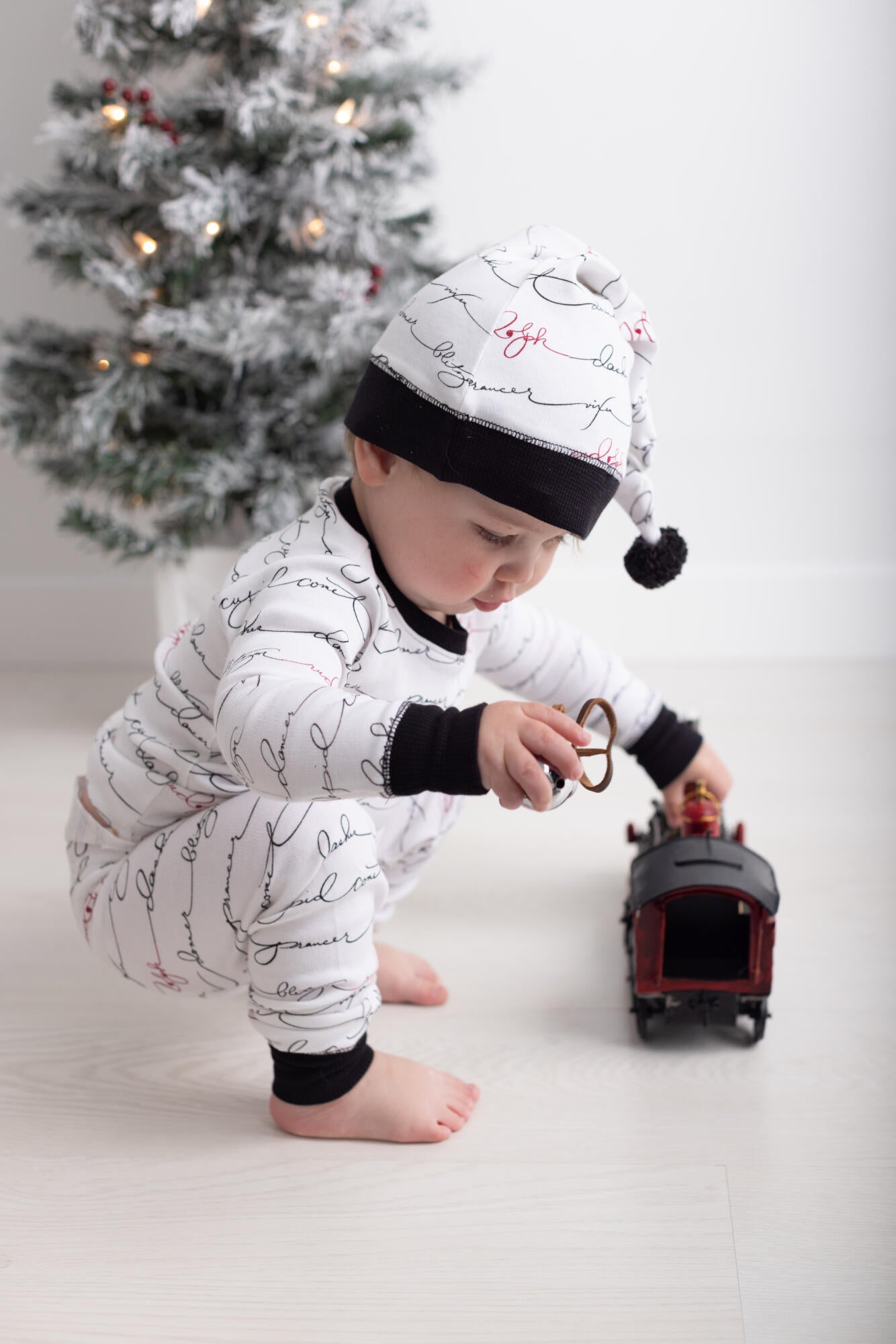 
                  
                    Organic Holiday Kid's PJ & Cap Set in Writing Reindeer
                  
                