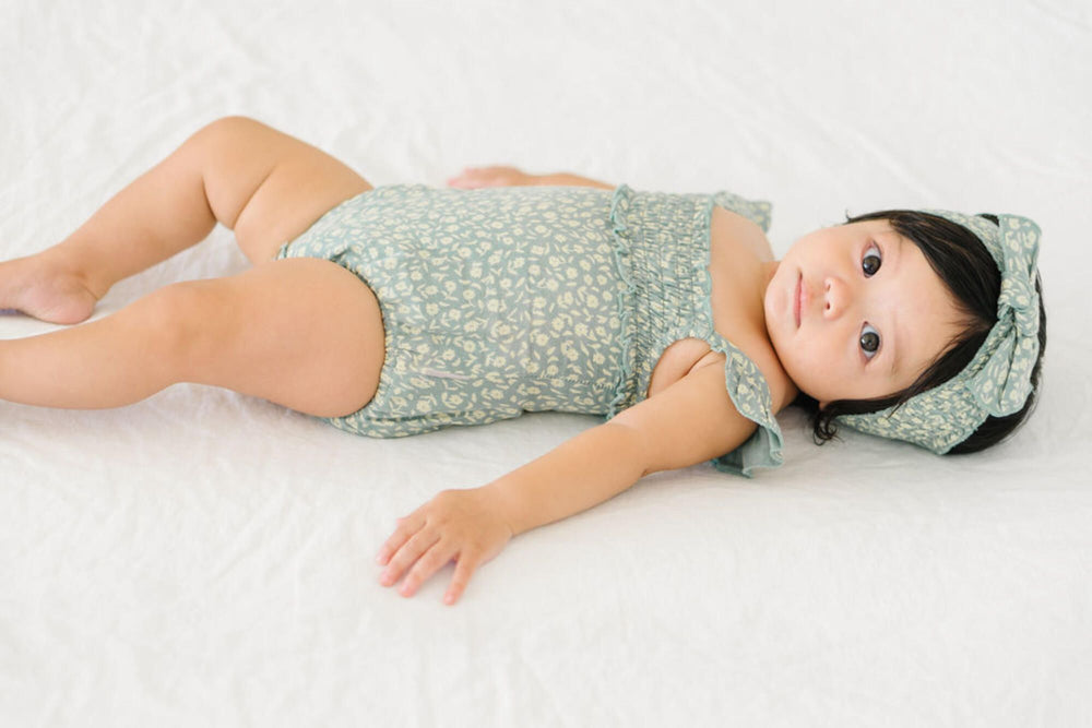 
                  
                    Printed Muslin Sleeveless Bodysuit in Lagoon Floral
                  
                