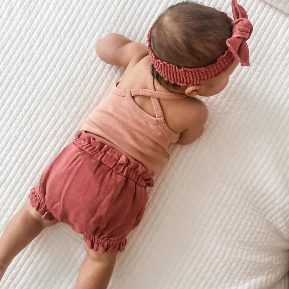 
                  
                    Mauve Ruffle Criss-cross Bodysuit
                  
                