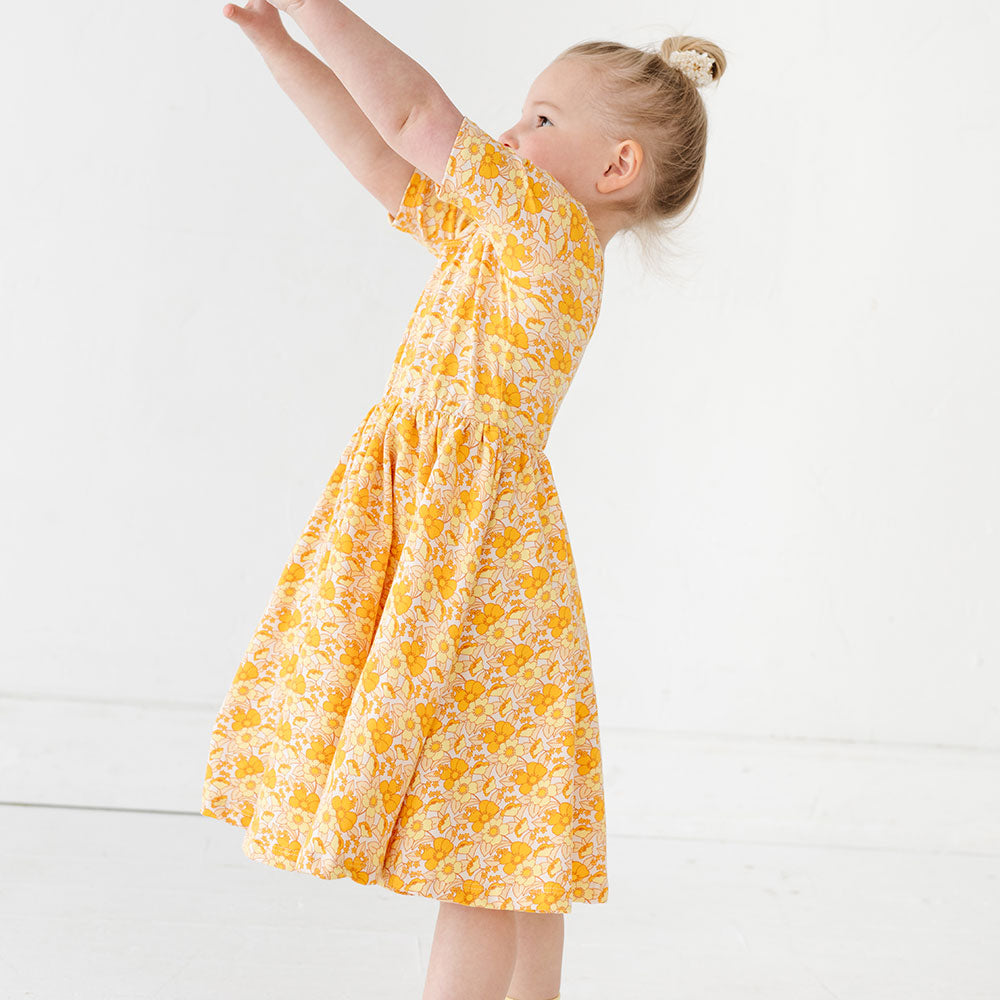 
                  
                    The Short Sleeve Ballet Dress in Sunny Flowers
                  
                